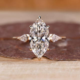 Marquise diamond engagement ring with hidden halo design.