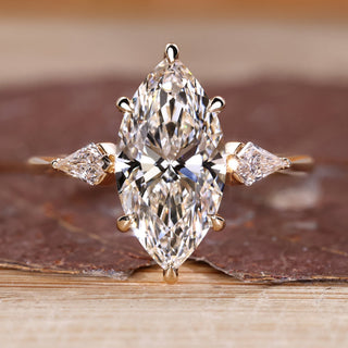 Marquise diamond engagement ring with hidden halo design.