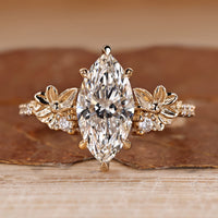 Marquise diamond ring pave round diamond nature style.