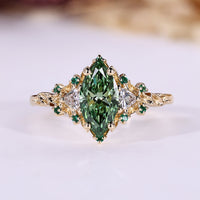 Marquise cut diamond ring trillion side stones.