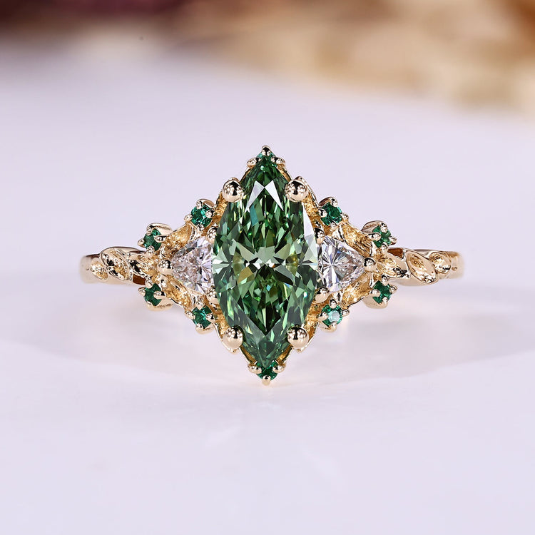 Marquise cut diamond ring trillion side stones.