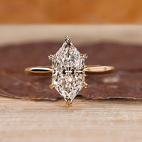 Dutch marquise ring with round diamond hidden halo.