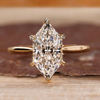 Dutch marquise ring with round diamond hidden halo.