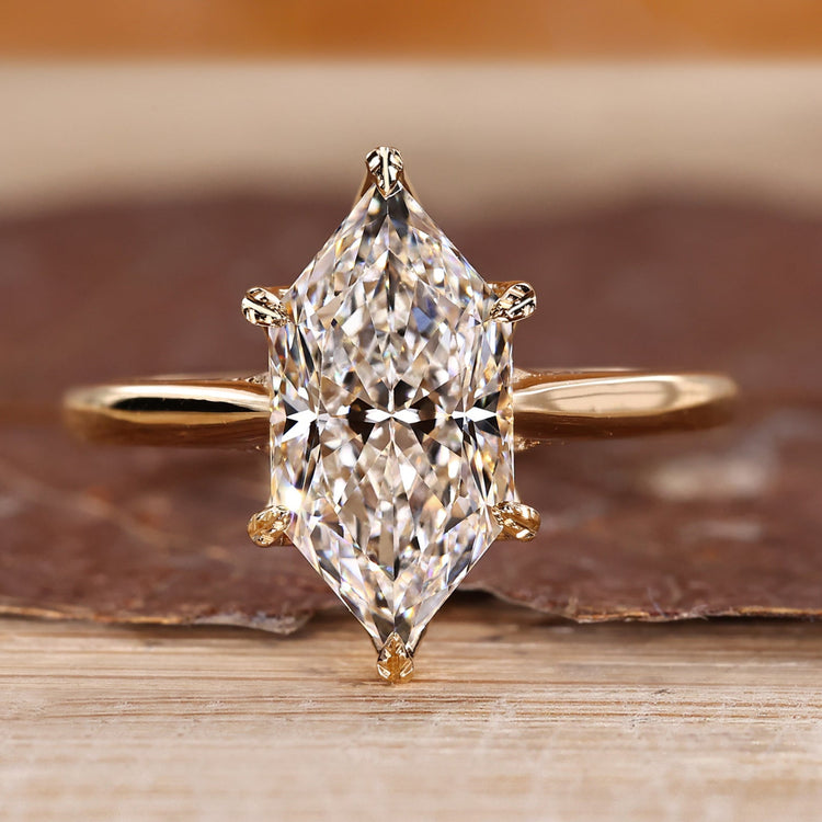 Dutch marquise ring with round diamond hidden halo.