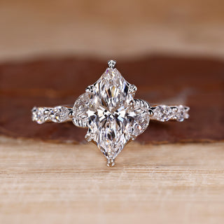 Nature inspired engagement ring with marquise cut diamond centre.