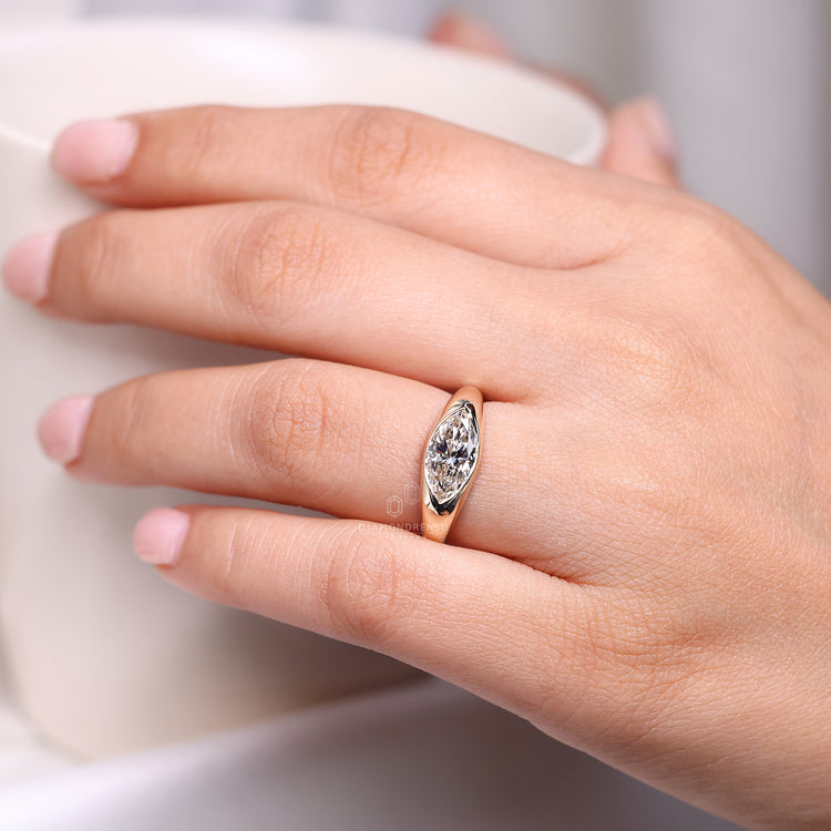 Lab grown marquise diamond flush engagement ring.