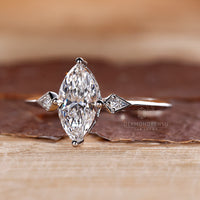 Lab grown marquise diamond ring three stone style.