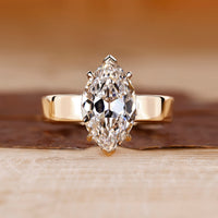 Solitaire diamond engagement ring with marquise old European cut.