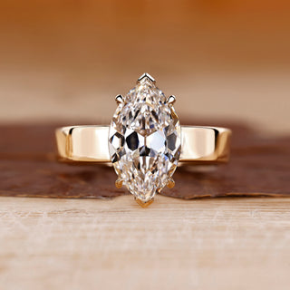 Solitaire diamond engagement ring with marquise old European cut.