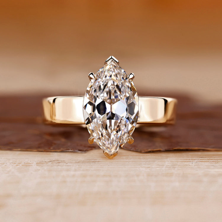 Solitaire diamond engagement ring with marquise old European cut.