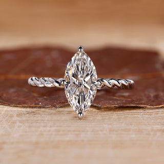 Marquise diamond ring solitaire compass prong twisted.
