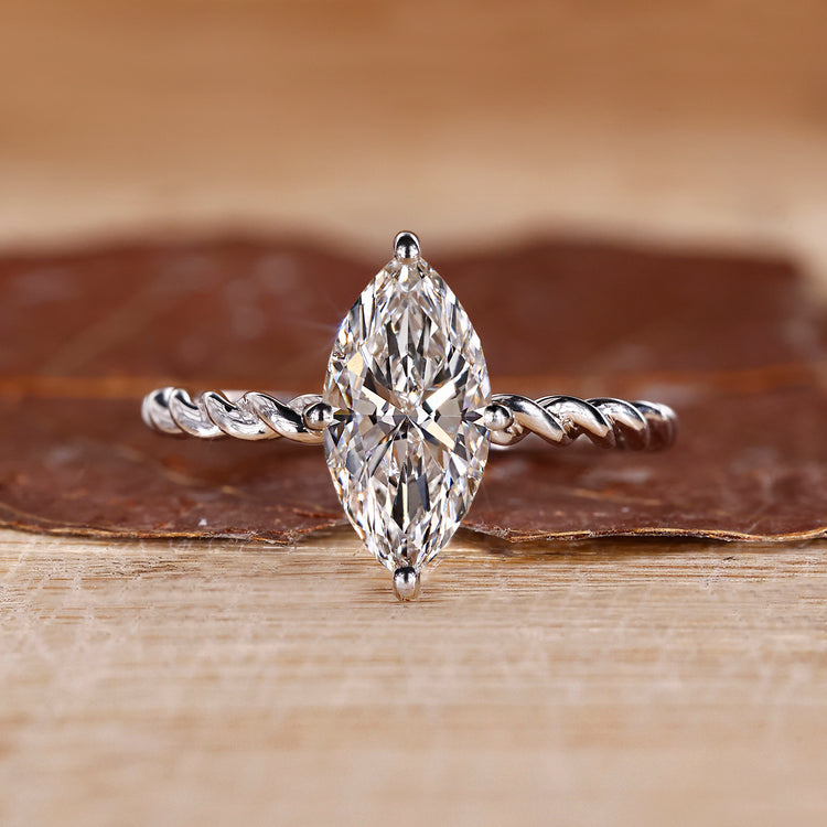 Marquise diamond ring solitaire compass prong twisted.