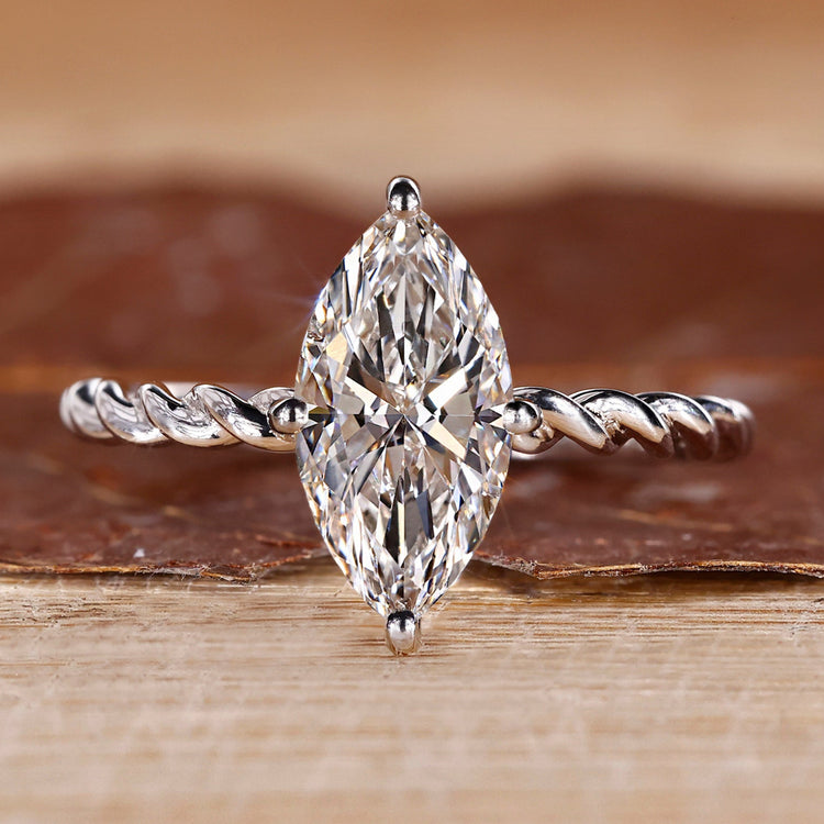 Marquise diamond ring solitaire compass prong twisted.