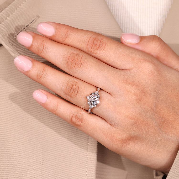 Pear cut diamond ring IGI certified cluster style.