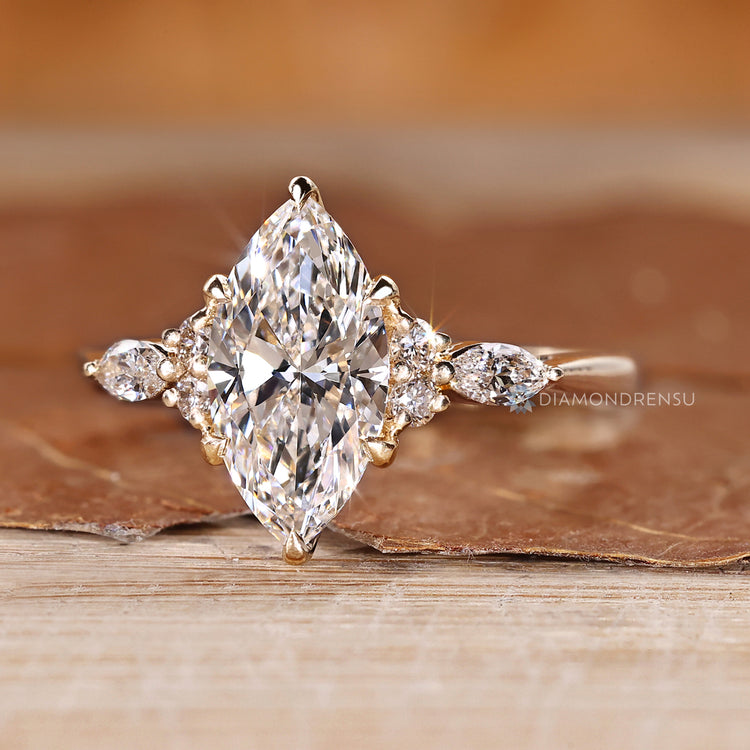 Seven stone marquise diamond ring with side stones.