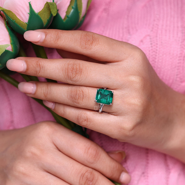 Emerald cut ring distance pave marquise diamond style.