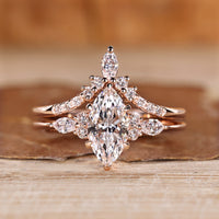 Marquise diamond bridal set with round and marquise side stones.