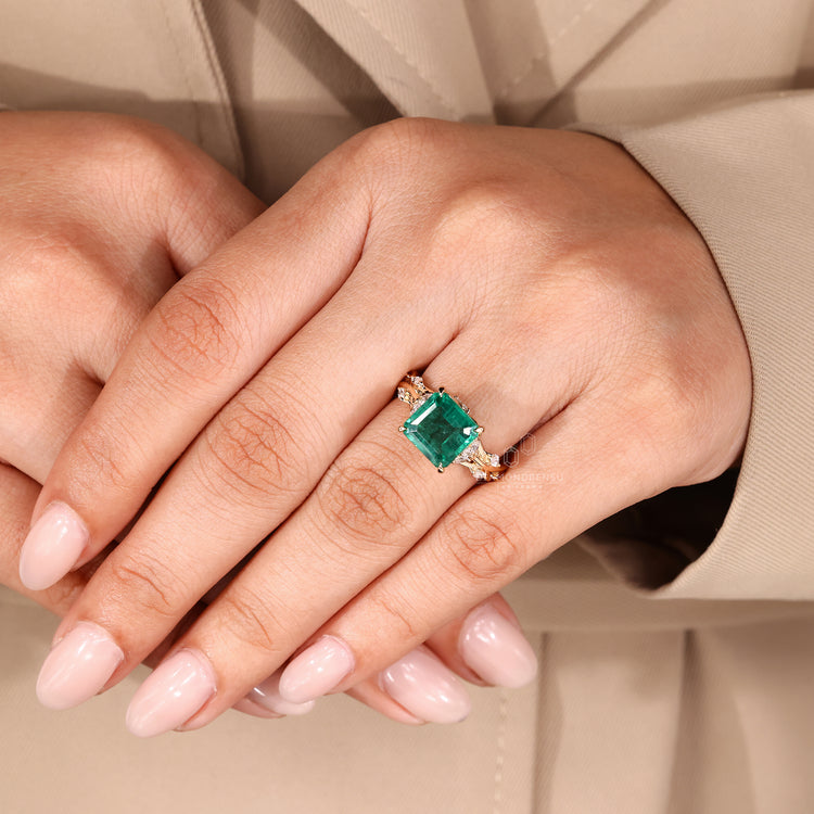 Asscher gemstone ring emerald marquise stones design.