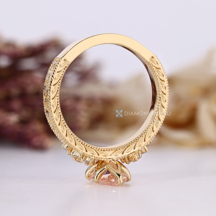 Diamondrensu AU marquise diamond ring with pink diamond.