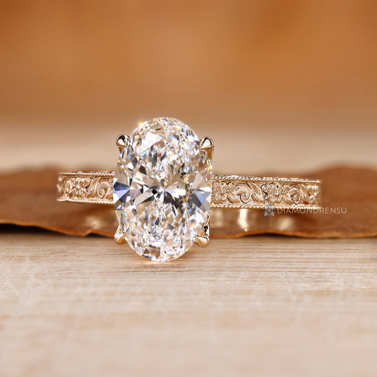 Vintage oval cut diamond ring with bridge accents.