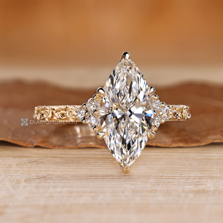 Art Deco marquise diamond ring with round stones.