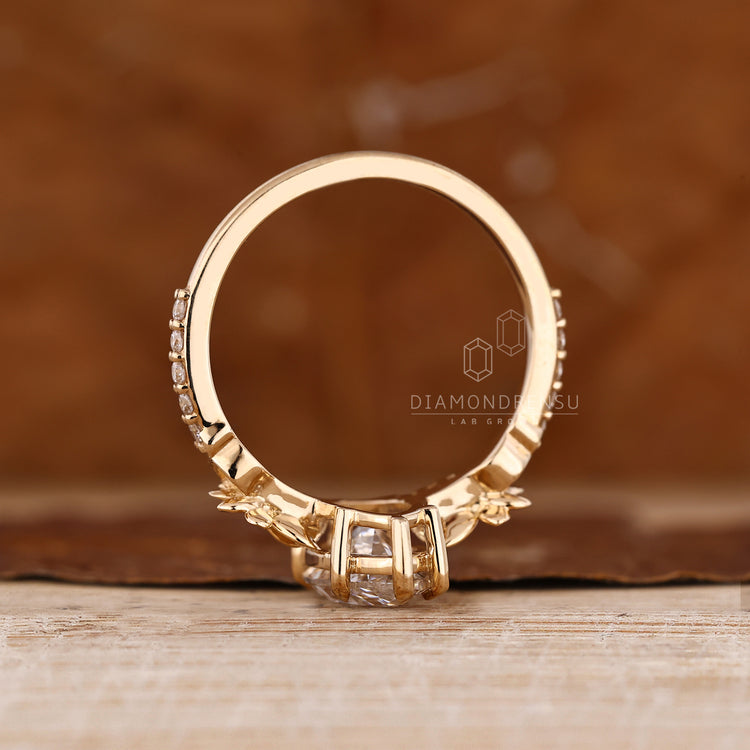 Marquise diamond ring with round diamond pave style.