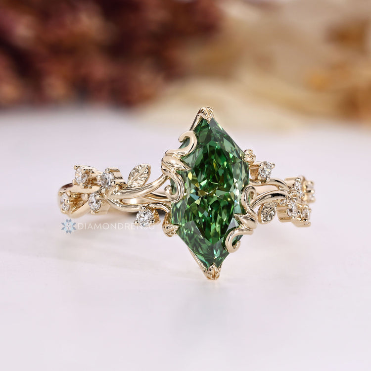 Dutch marquise diamond ring with cluster setting.