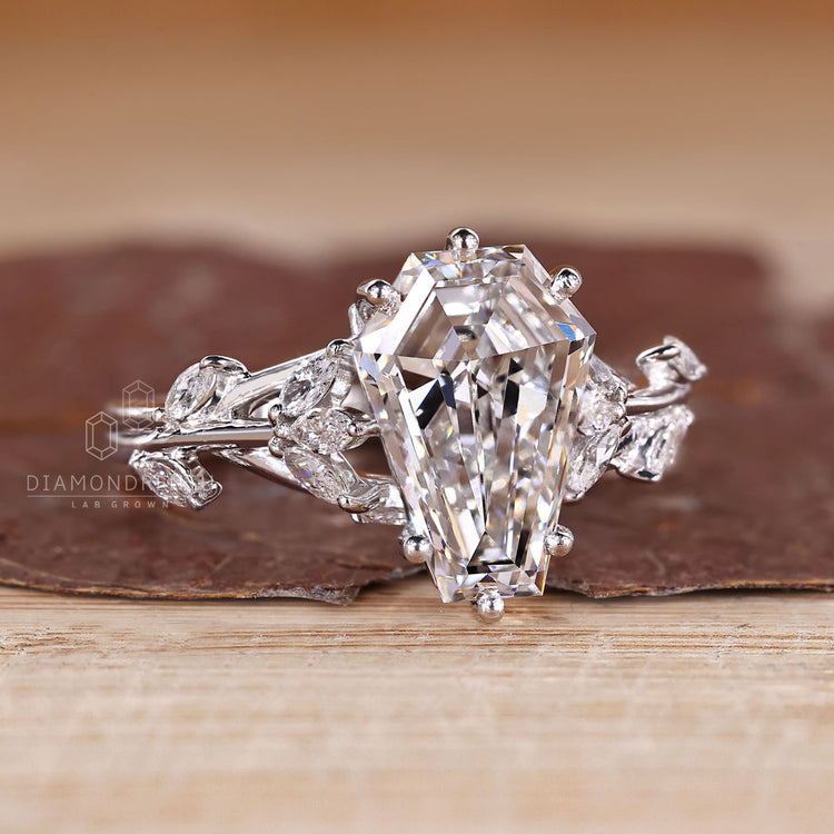 Nature inspired coffin diamond ring marquise stones.
