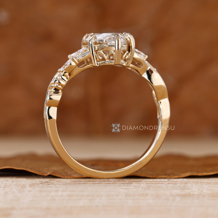 Marquise diamond ring with floral side stone setting.