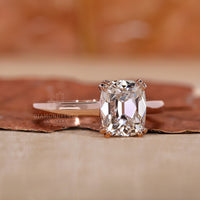 Solitaire cushion old cut ring cathedral double prong.