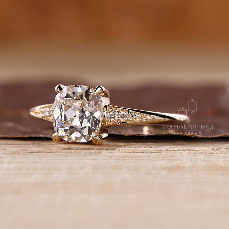 Cushion Old European Cut Ring elegant seven stone design.