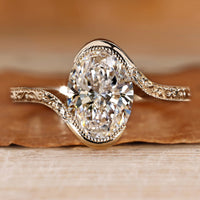 Oval cut diamond ring with solitaire setting.