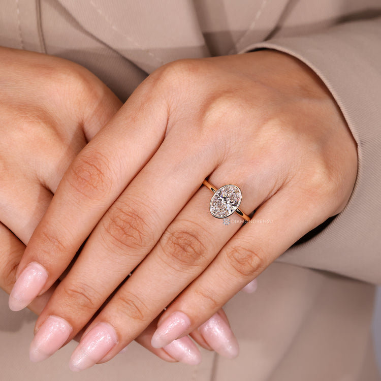Handmade oval cut diamond solitaire engagement ring.