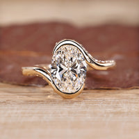 Oval cut diamond ring hidden pave half bezel bypass.