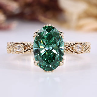 Oval diamond ring with green diamond and side stones.