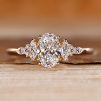 Oval cut diamond ring marquise round muse tapered shank.