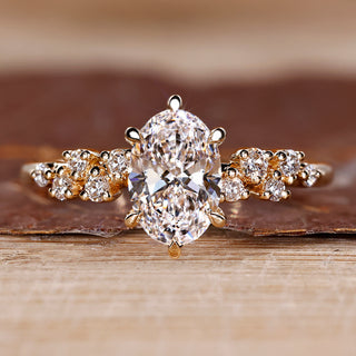 Oval cut diamond ring round side stones cluster vintage.
