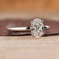 Lab grown oval engagement ring hidden halo style.