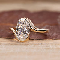 Lab grown oval diamond ring hidden pave bypass.