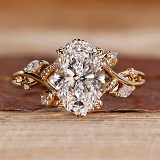 Oval cut diamond ring marquise round cluster leaf prong.