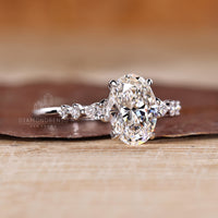 Lab grown oval diamond ring pear round side stones.