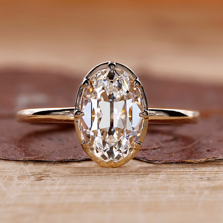 Oval old European cut diamond ring eight claw prong.