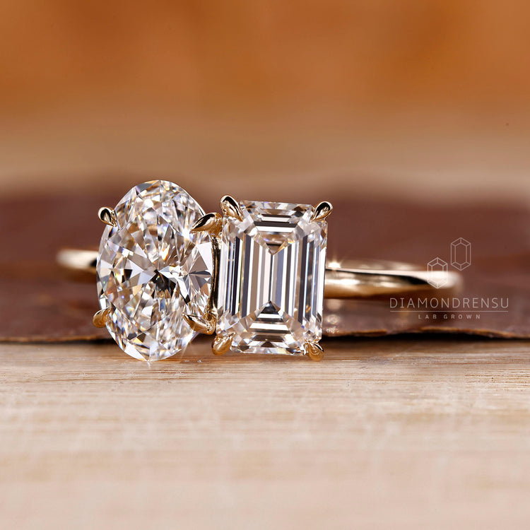 Lab grown toi et moi ring emerald oval diamond.