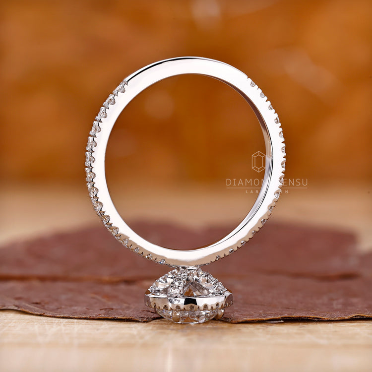 Unique halo setting round diamond engagement ring.