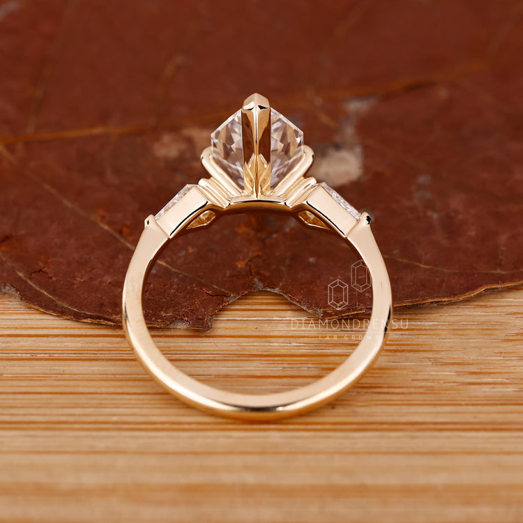Custom Engagement Ring with three stone layout and unique cuts.