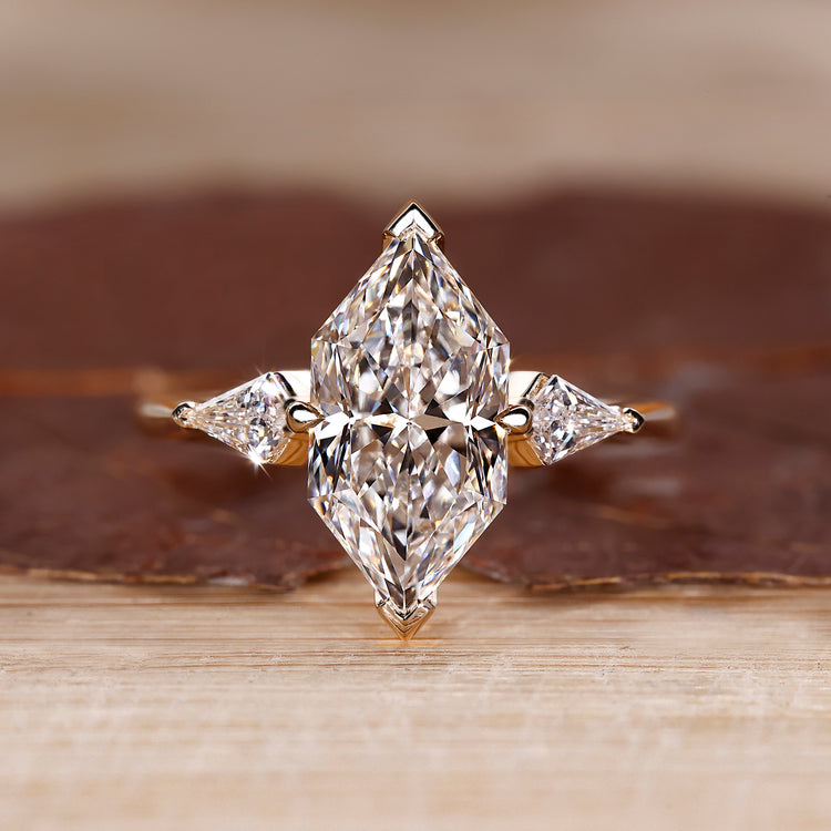 Three Stone Engagement Ring with Dutch marquise center diamond.