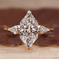 Three Stone Engagement Ring with Dutch marquise center diamond.