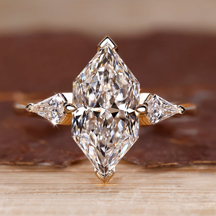 Three Stone Engagement Ring with Dutch marquise center diamond.