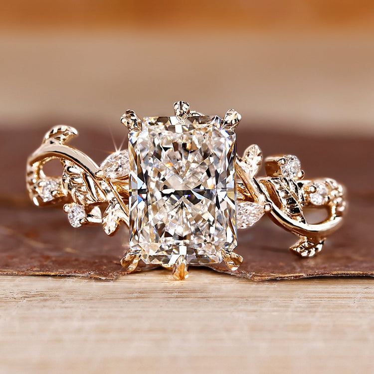 Nature inspired radiant diamond ring with leaf-style prongs.