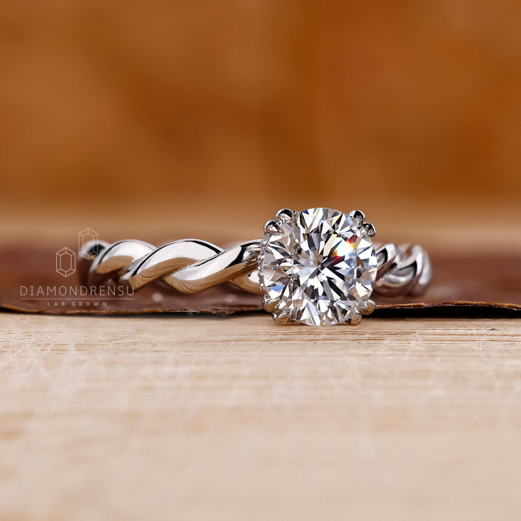Double claw prong round cut diamond ring.